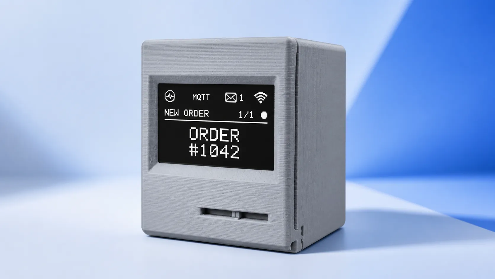 A grey Notificator Base device showing a monochrome new-order alert